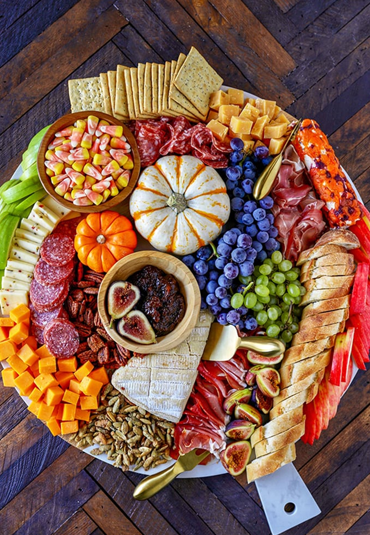 Number 2 Pencils platter is complete with soft and hard cheeses, pumpkin seeds, meets, crackers, and candy corn.