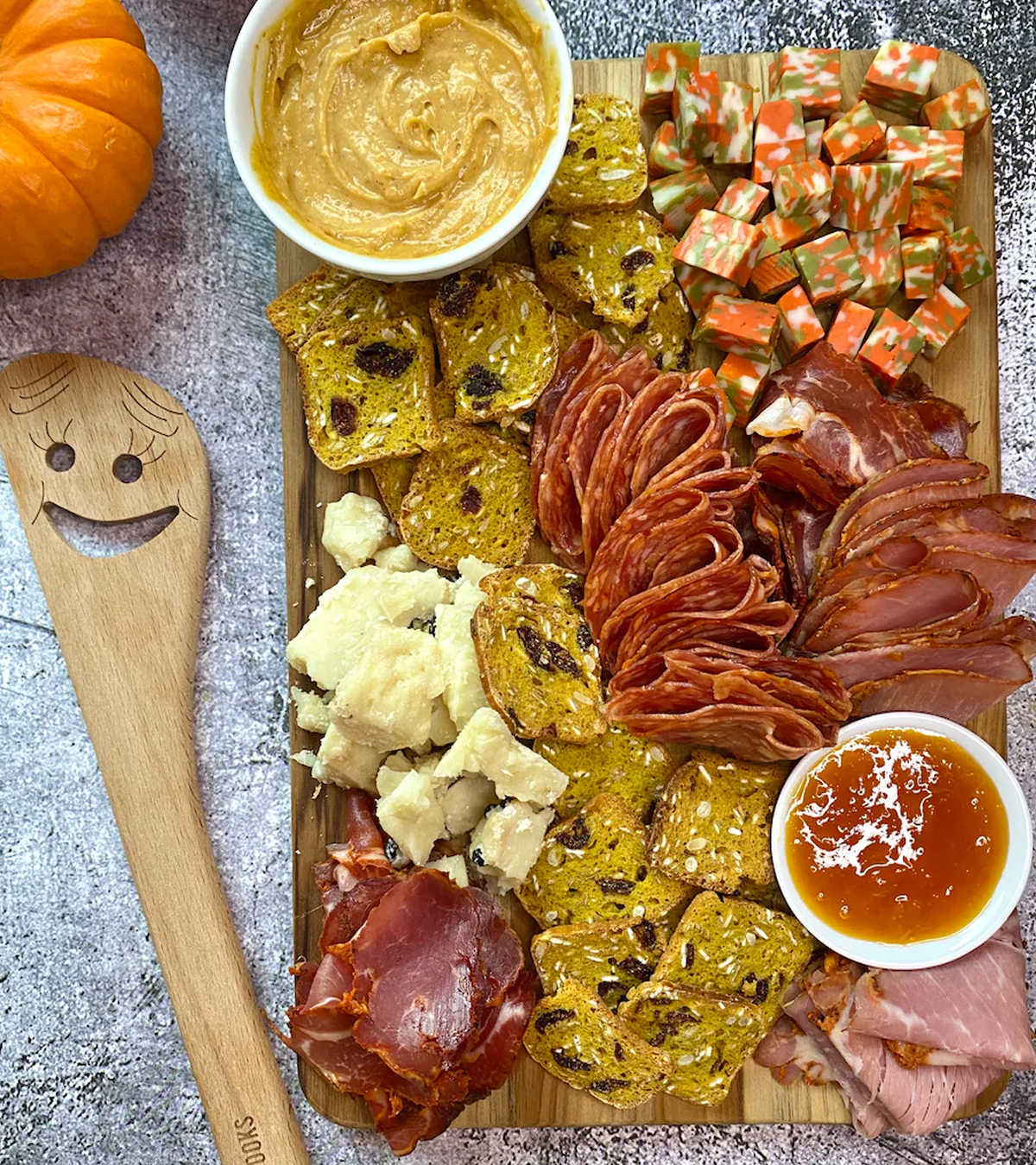 Pumpkin butter cream cheese, spicy meat, spicy cheese, and crackers are included on Pat Cooks' spicy charcuterie board.