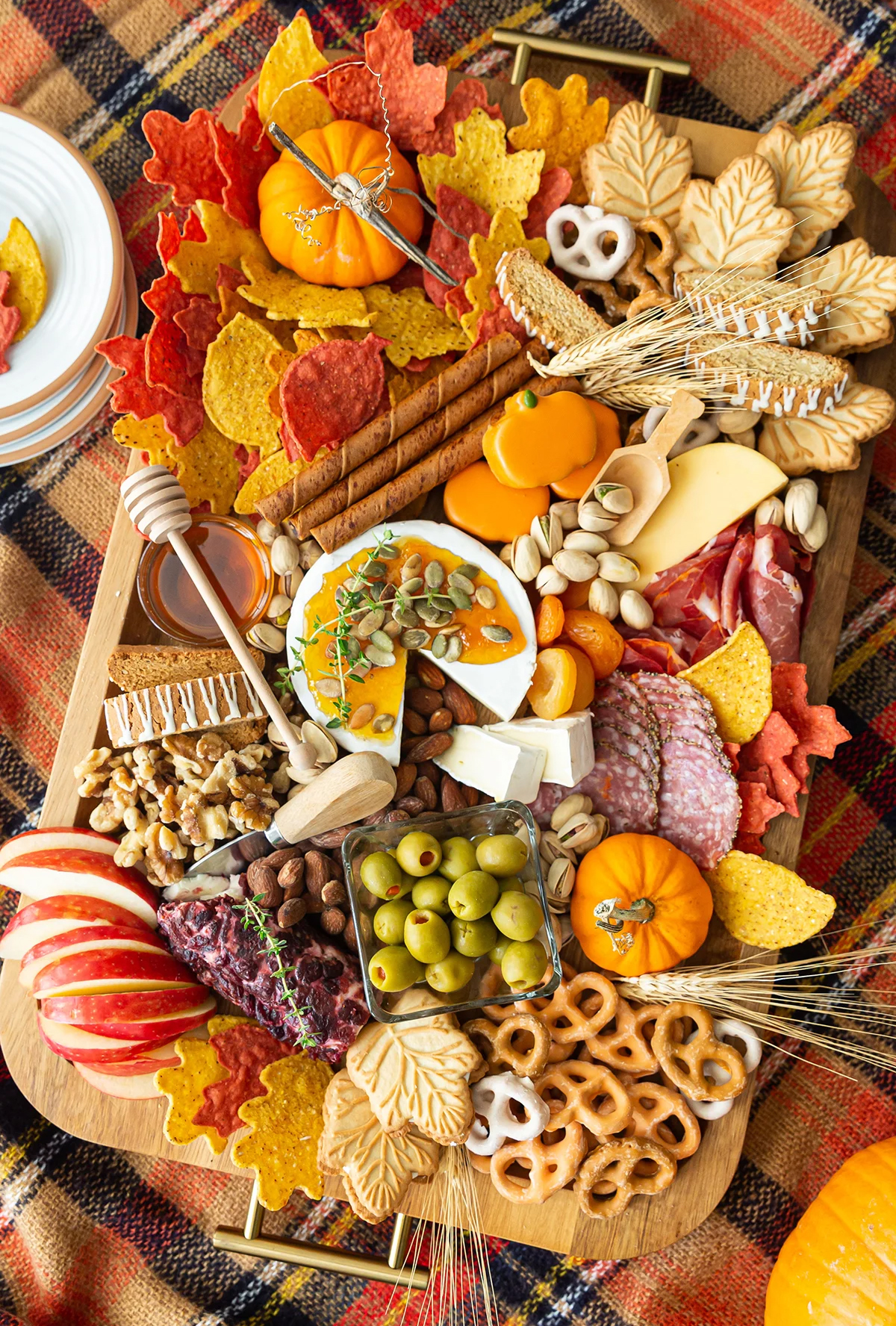 Pizzazzerie's charcuterie board includes creamy cheeses, cookies, meats, and nuts.
