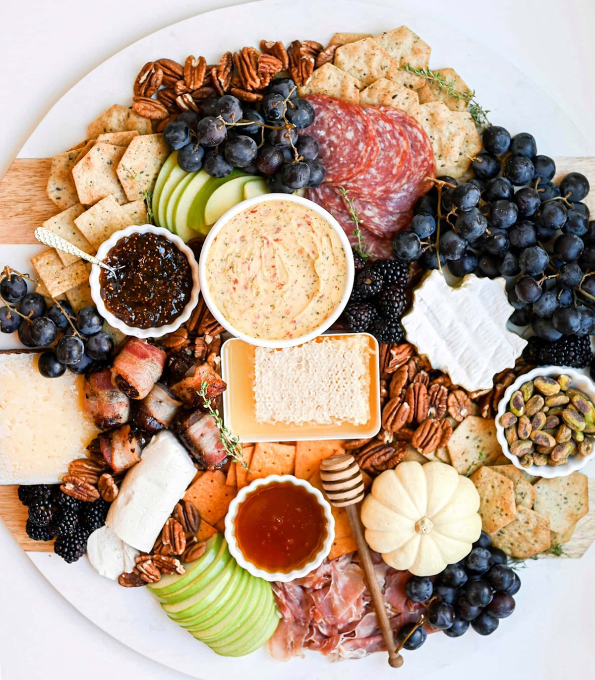 Rebecca Taig's board is full of gluten-free crackers, cheeses, seasonal fruit, nuts, and meats.