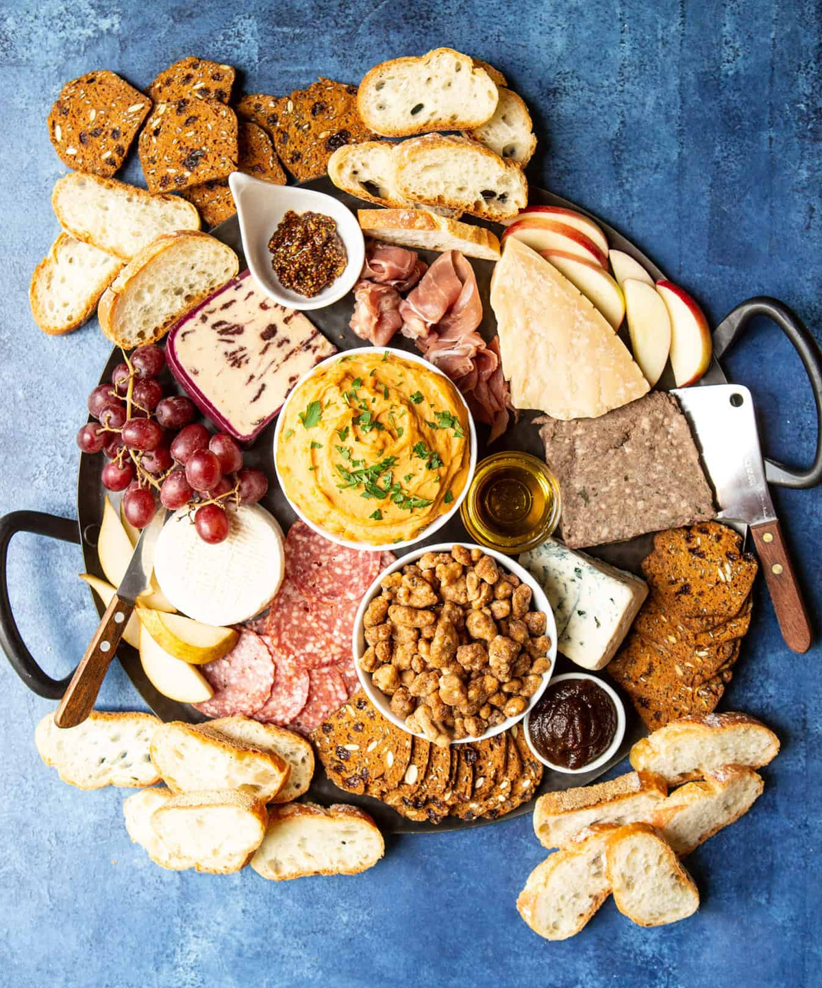 Sweet potato hummus, bread, grapes, nuts, meats, and cheese fill Shared Appetite's fall board.