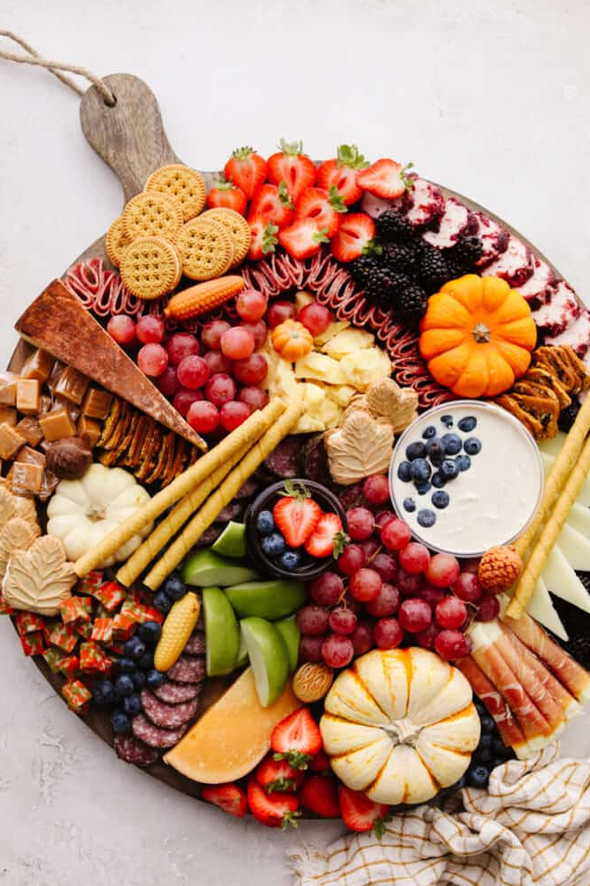 strawberries, dips, cookies, and candies fill the recipe critic's fall board.