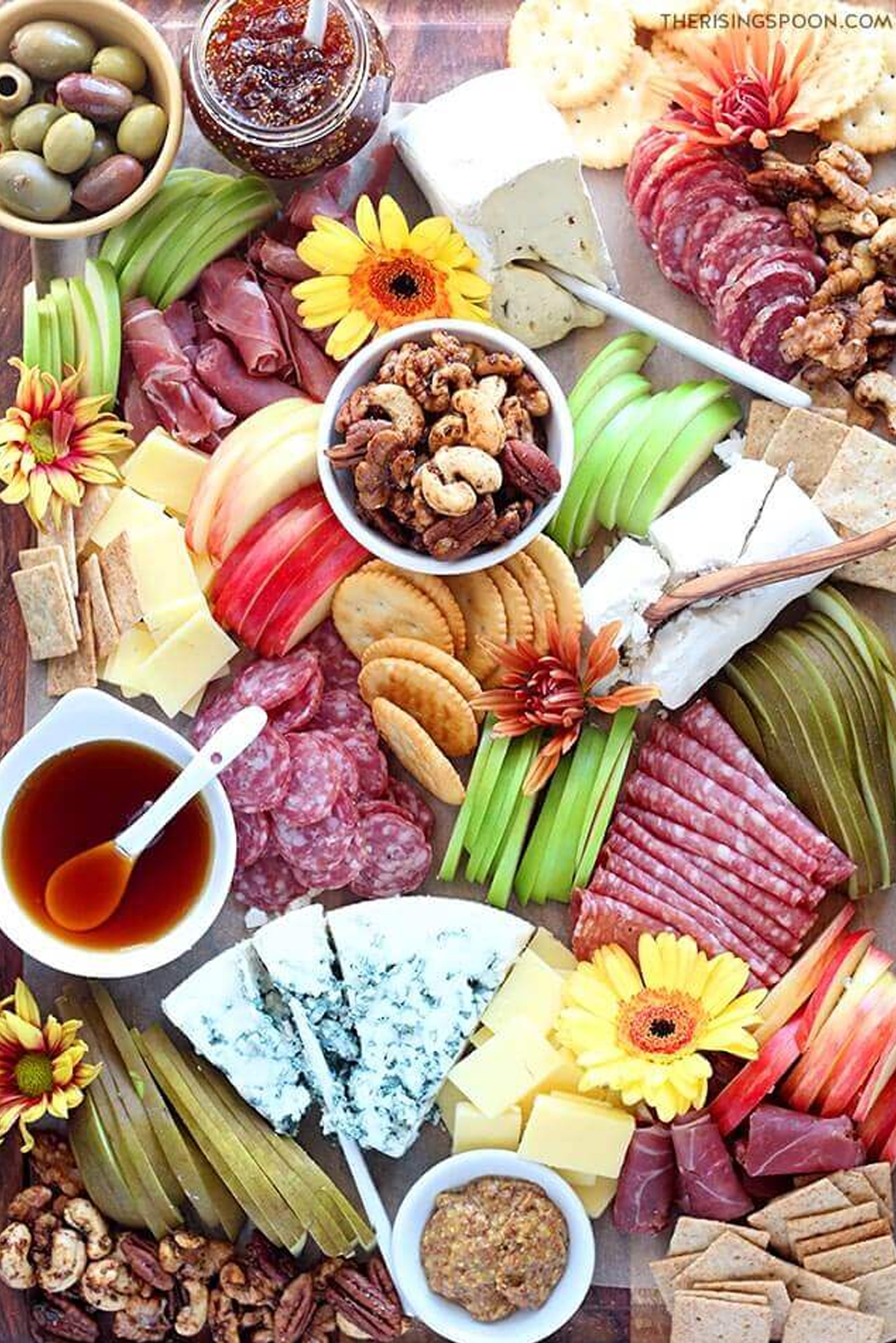 The Rising Spoon's autumn board includes curated cheese, seasonal fruit, meats, nuts and crackers.