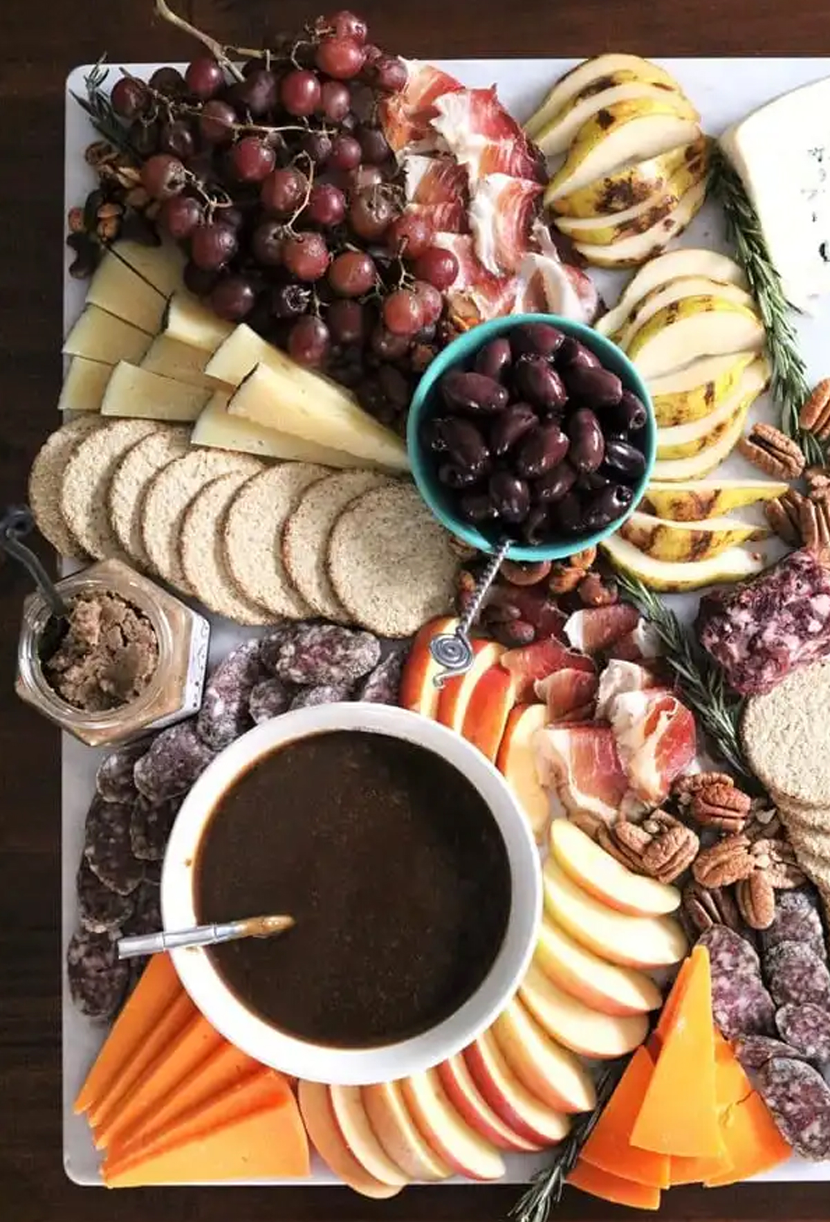 Apple cider caramel dip, apples, pears, pecans, and cheese fill The Spiffy Cookie's fall board.
