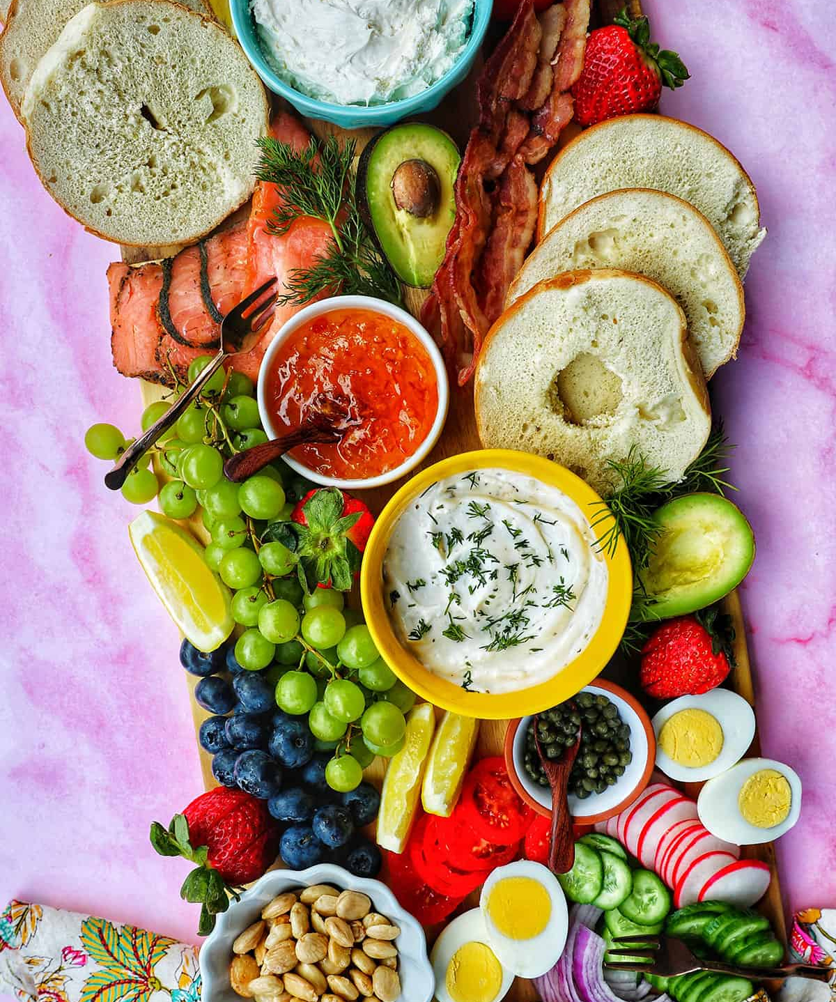 urban bliss life created a bright board full of bagels, lox, grapes, and more. 