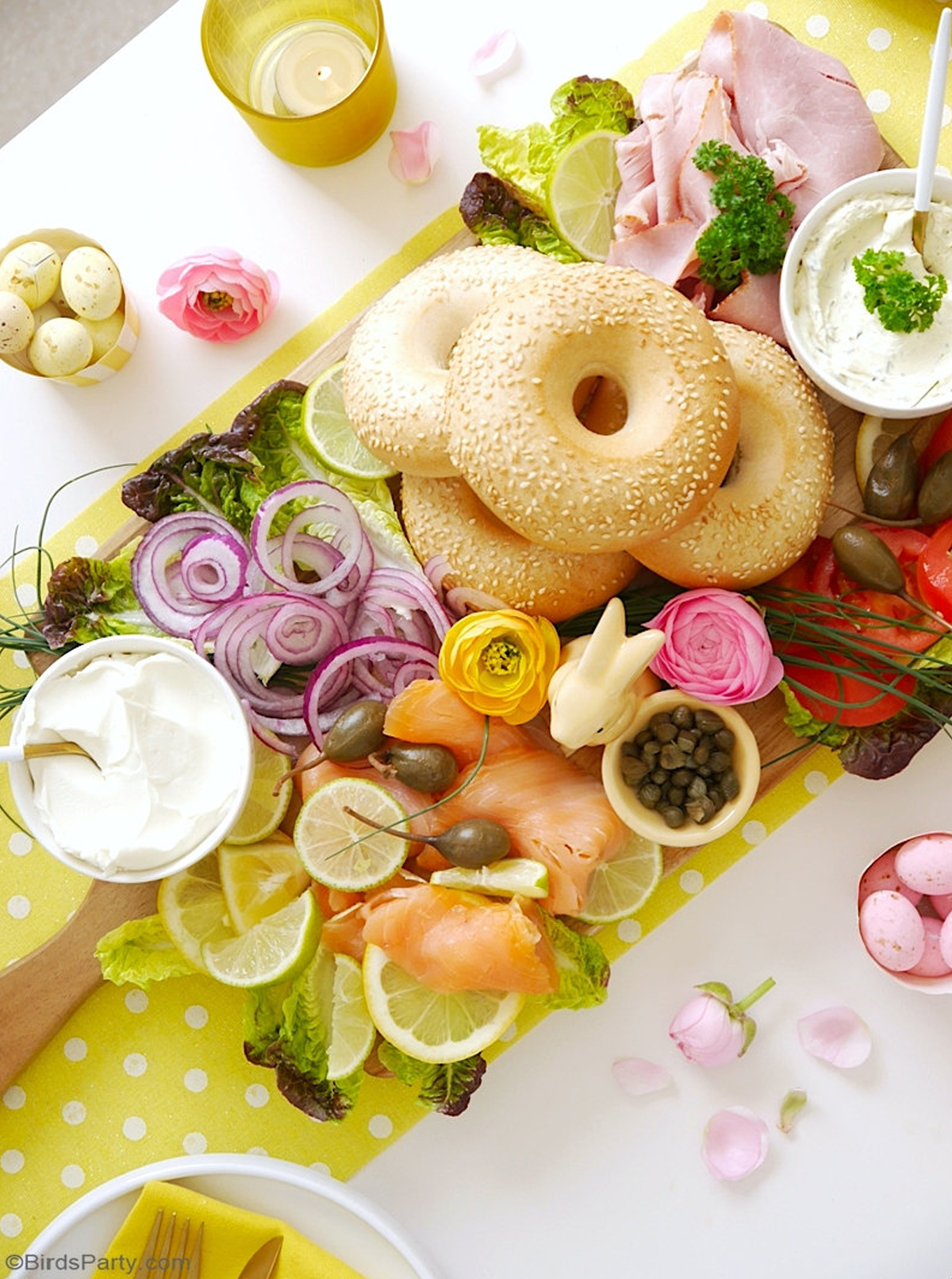 birds party spring bagel board with salmon, capers, veggies, and more.