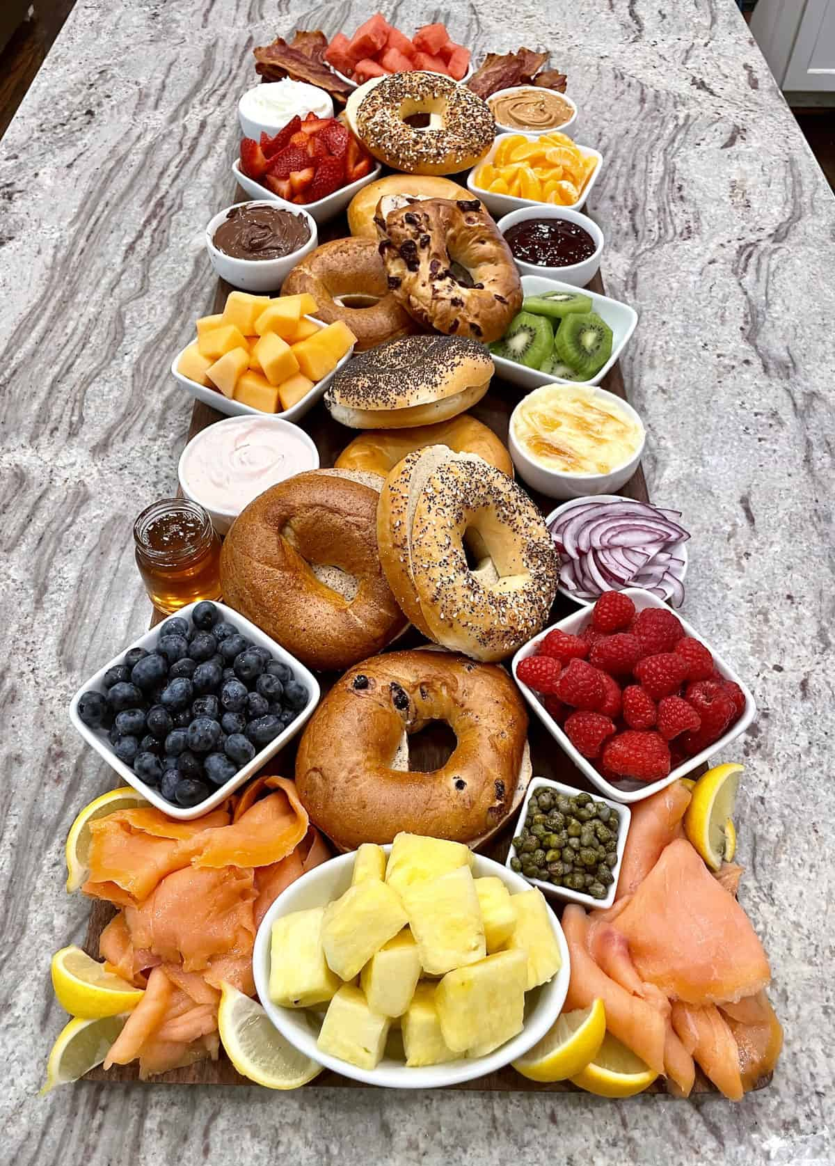pineapples, salmon, strawberries, honey, cream cheese, bagels, kiwi, bacon, and more from the bakermama