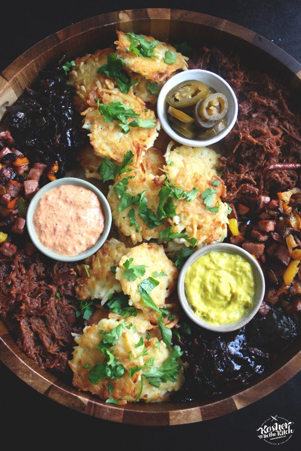 kosher in the kitchen includes latkes, gourmet sausage with peppers, and some delicious sauces and dips.