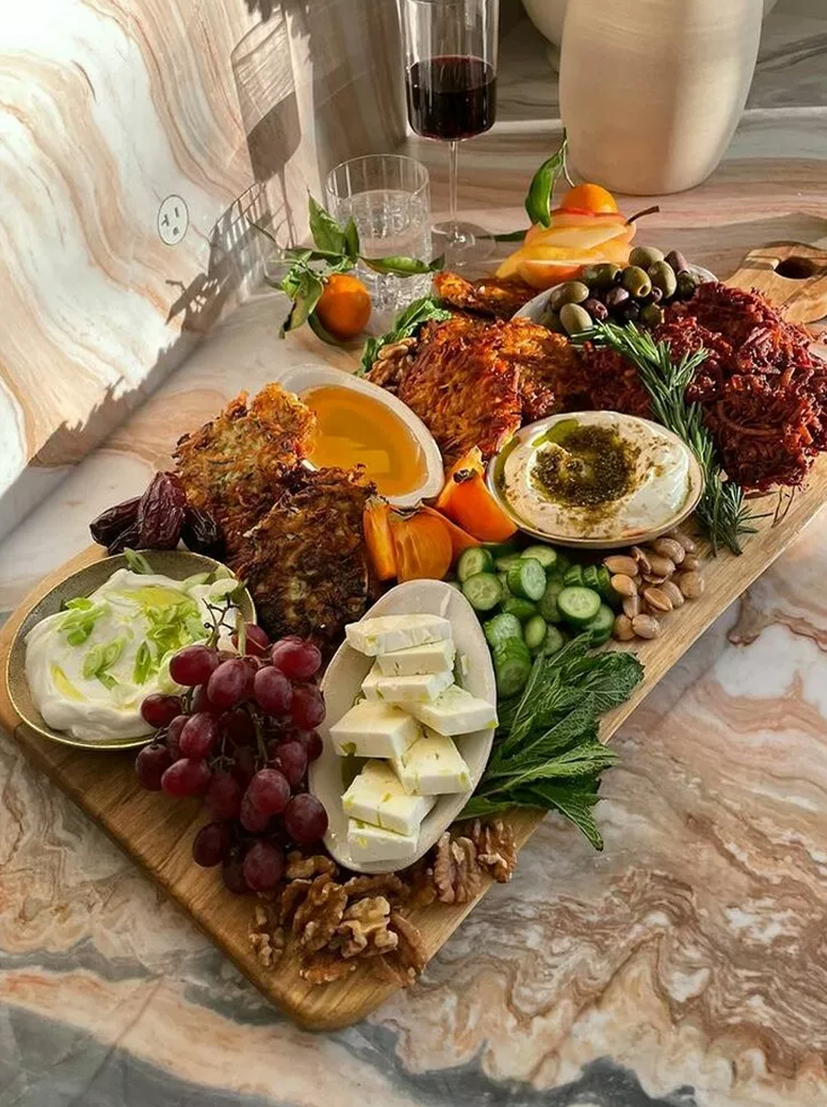 Eden eats includes latkes, honey, cheese, veggies, and more. 
