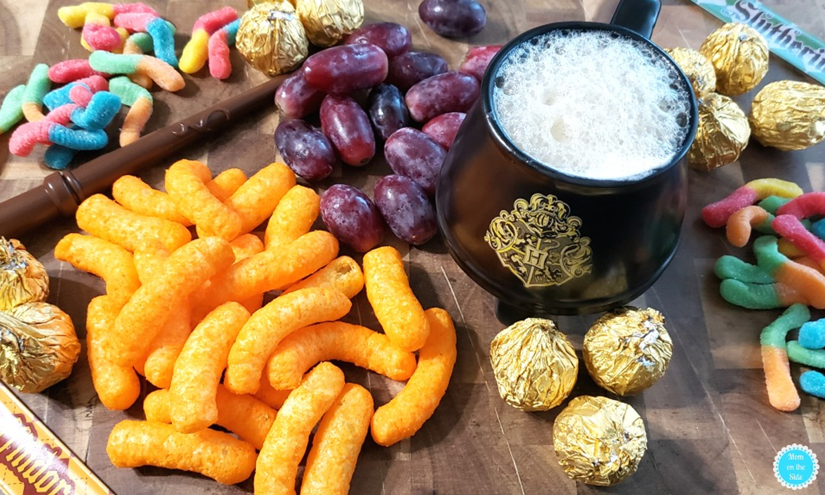 Mom on the Side prepared a Harry Potter board with fresh fruit, gummy worms, cheese puffs, and butter beer.