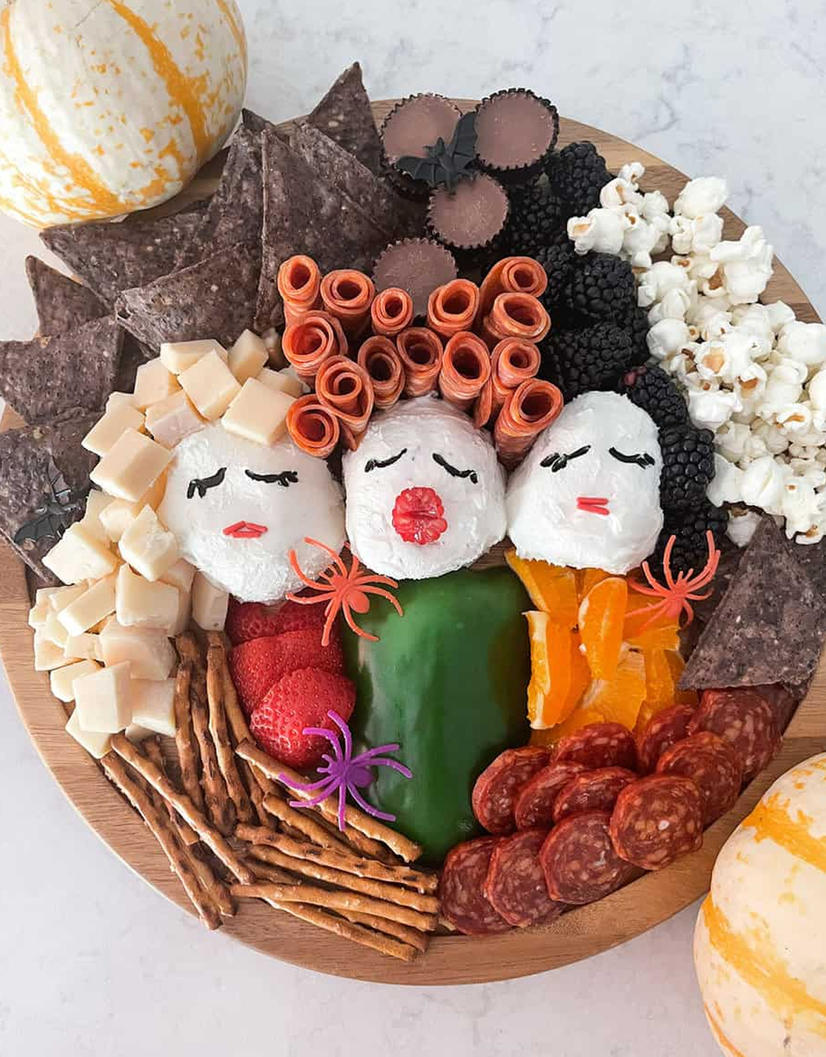Candy, popcorn, chips, cheese, meats, pretzels, and berries fill Alex Marie Jordan's Hocus Pocus Charcuterie Board.