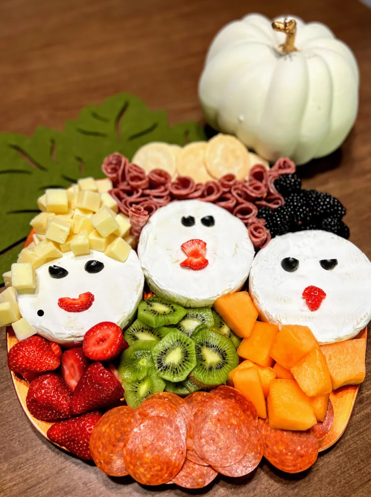 My No-Guilt Life's board includes strawberries, kiwi, cheese, meat, pepperoni, and cantaloupe. 