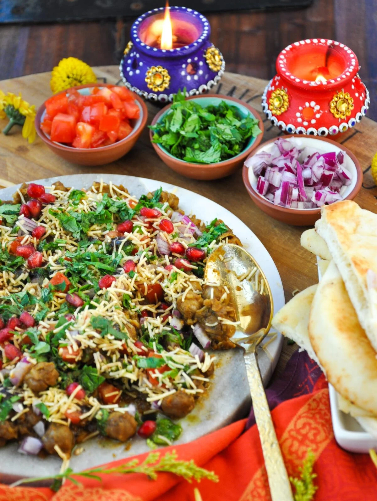 Honey, What's Cooking's board is presenting Punjabi Chole, Cilantro Chutney, tomatoes, green chilies, and red onions.