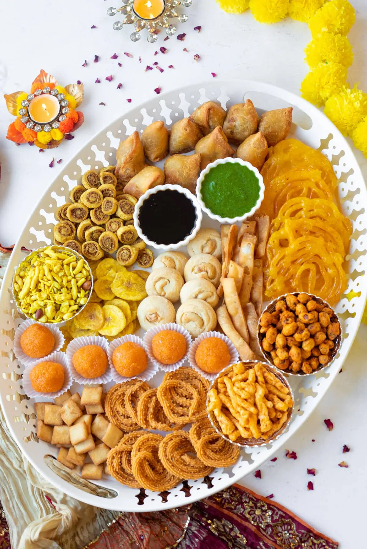 Samosas, tikki, or kebabs, spread of papdi chaat, and bhel fill Piping Pot Curry's board.