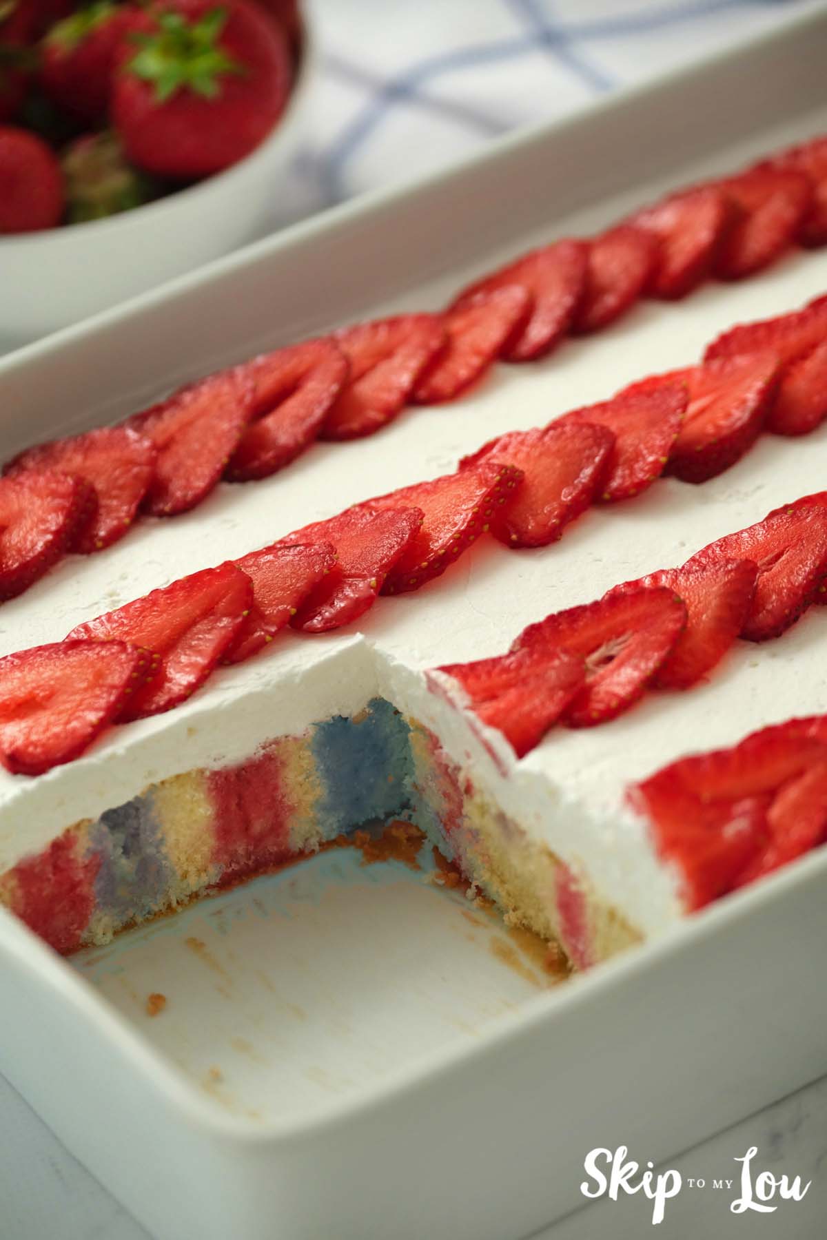 flag poke cake with piece missing
