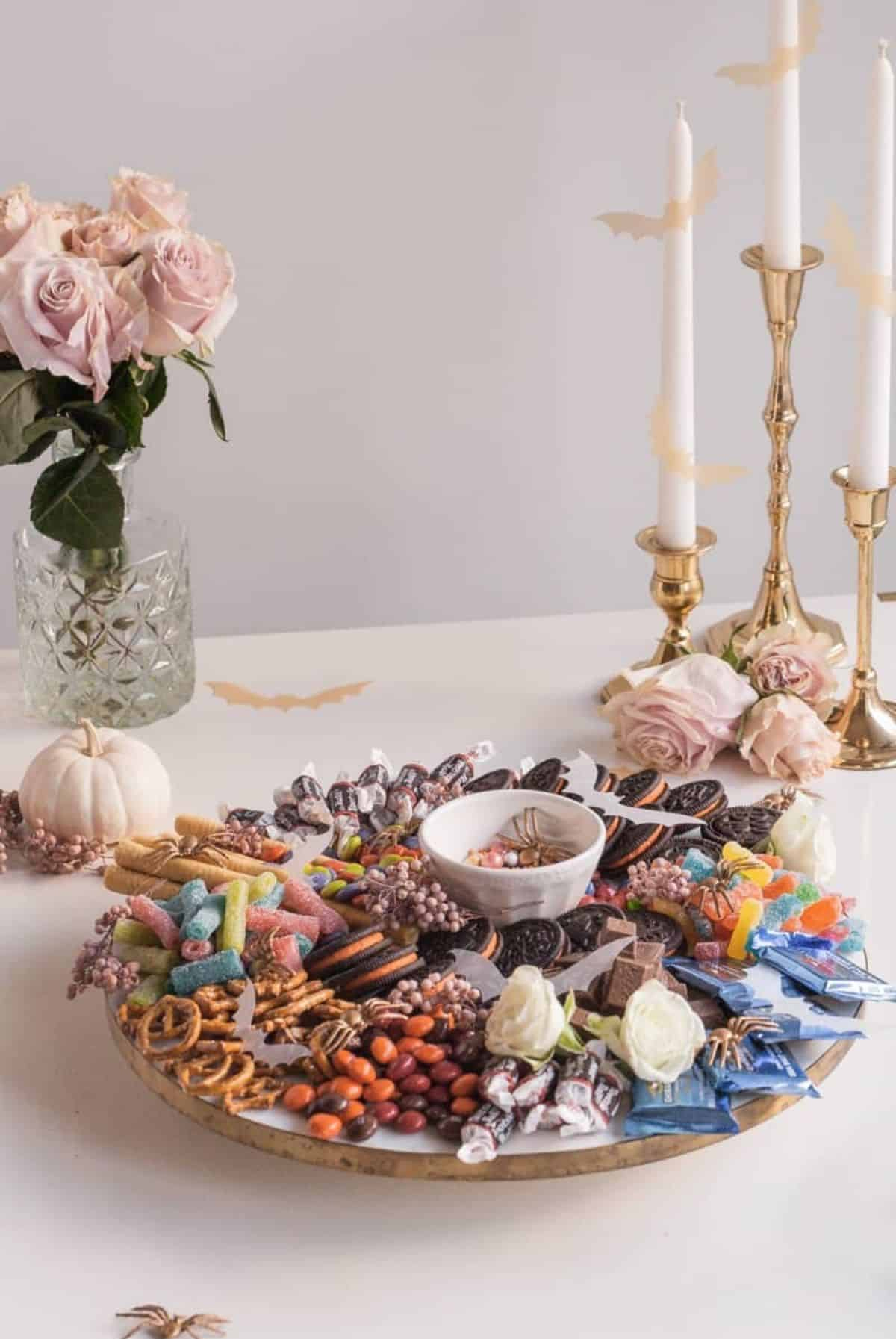 Amanda Wilens Halloween Candy Board is filled with cookies, candy, and pretzels.