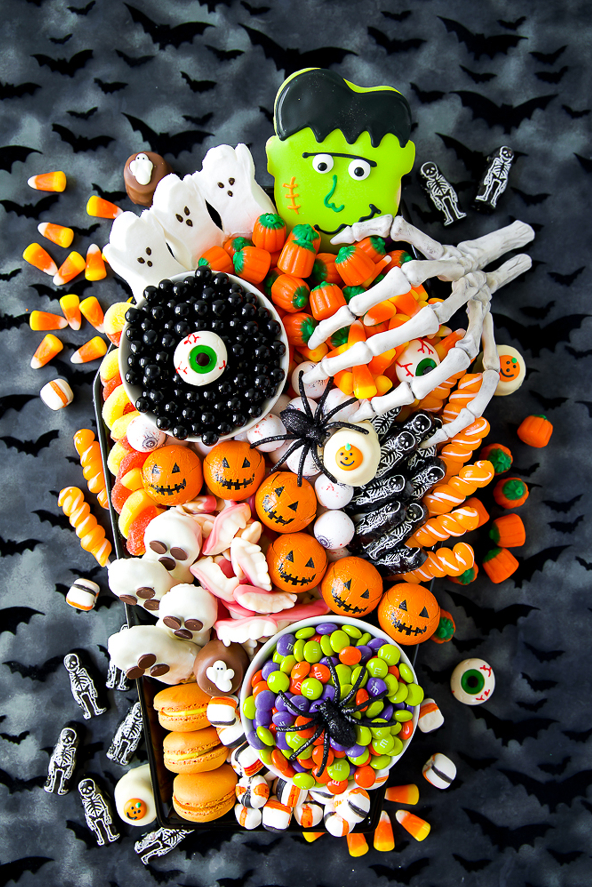 A Pumpkin and a Princess Halloween board showcases cookies and candy.