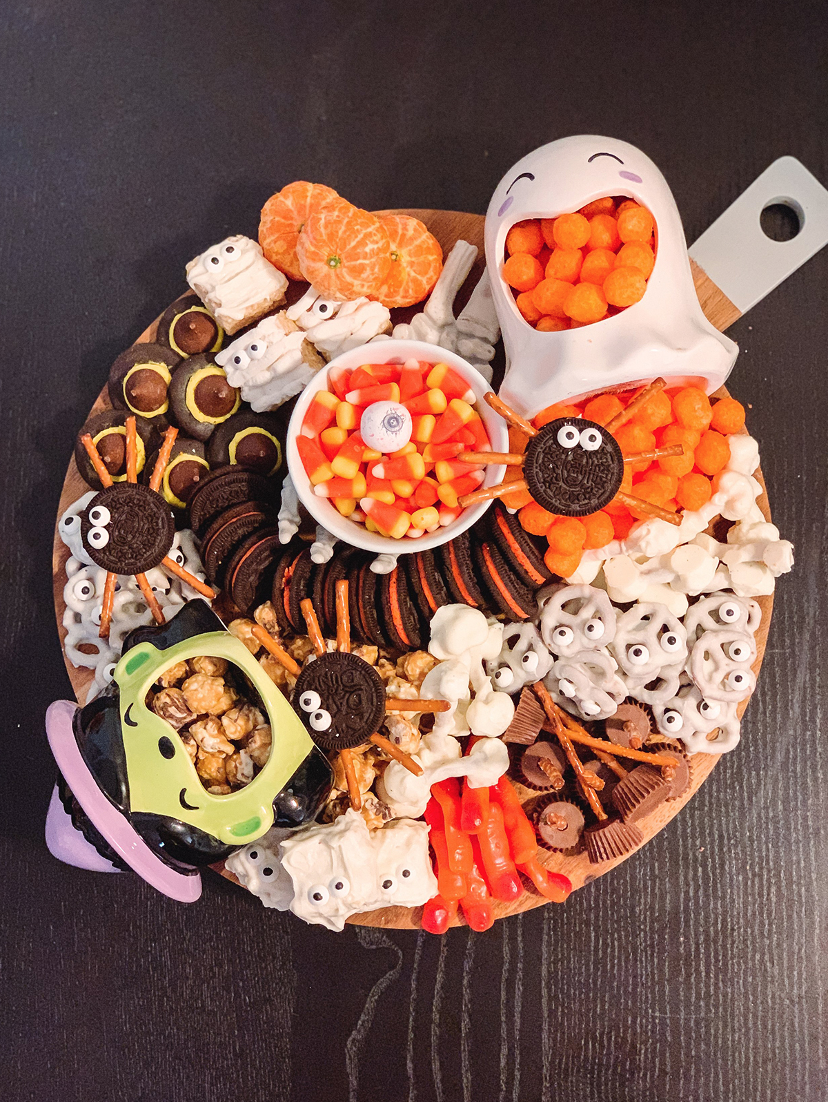 Chocolate-covered pretzels, Oreo spiders, caramel corn, cheese balls and clementine's are included on Cerriously's Halloween board.