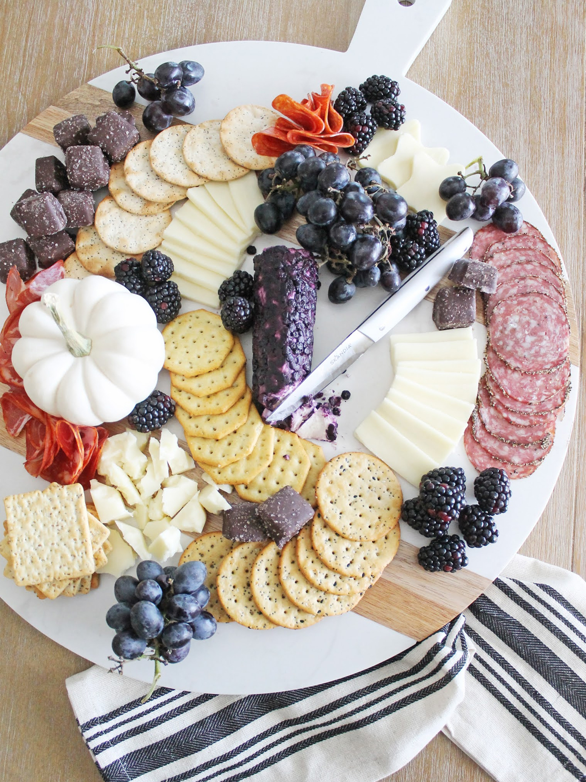 Meats, cheeses, chocolate, grapes, berries, and crackers are included on Courtney M. Browning's Halloween Cheese Board.