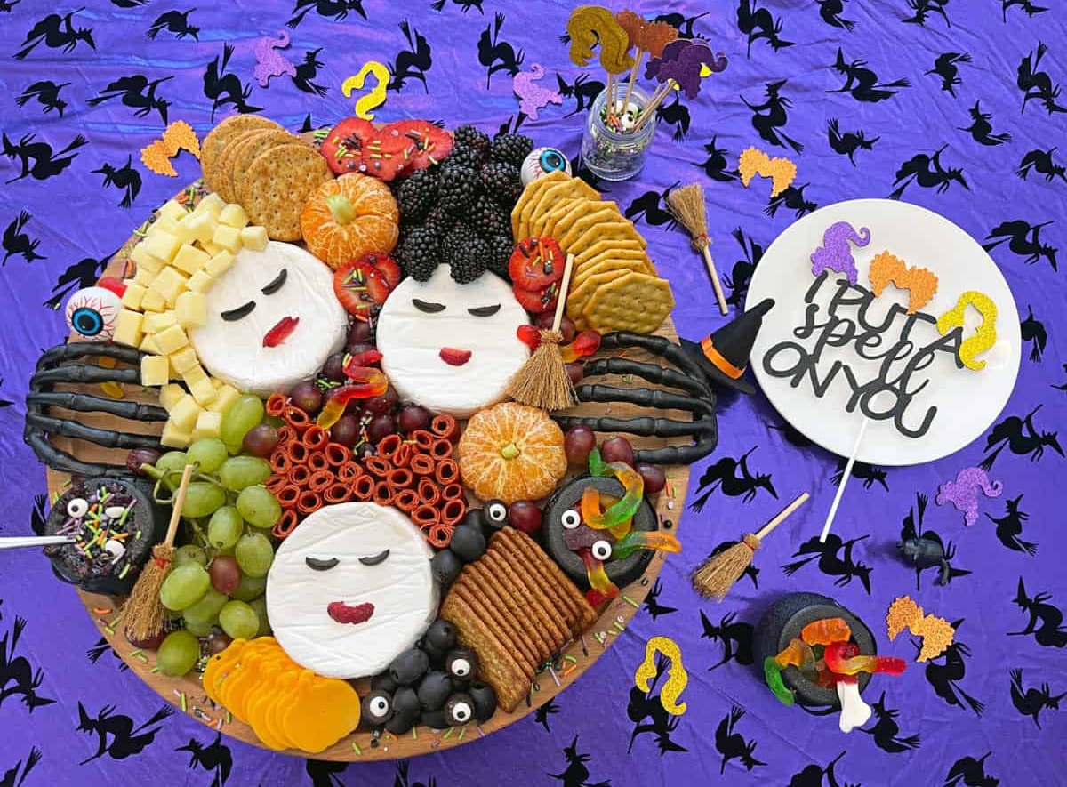 Healthy Family Project's Hocus Pocus board showcases crackers, fruit, candy, and cheese.