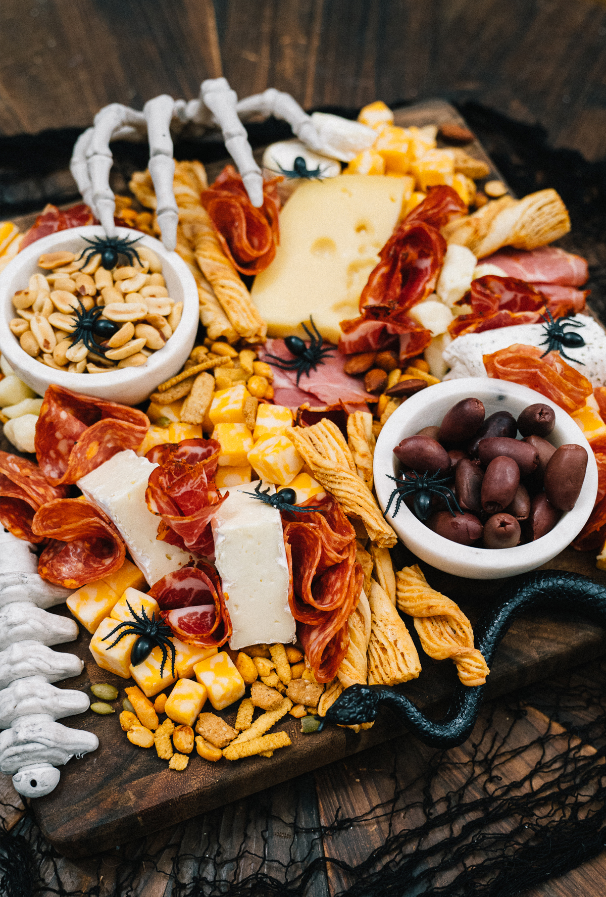 Ice Cream and Neon Dreams Halloween board includes cheese, meats, nuts, and pretzels.