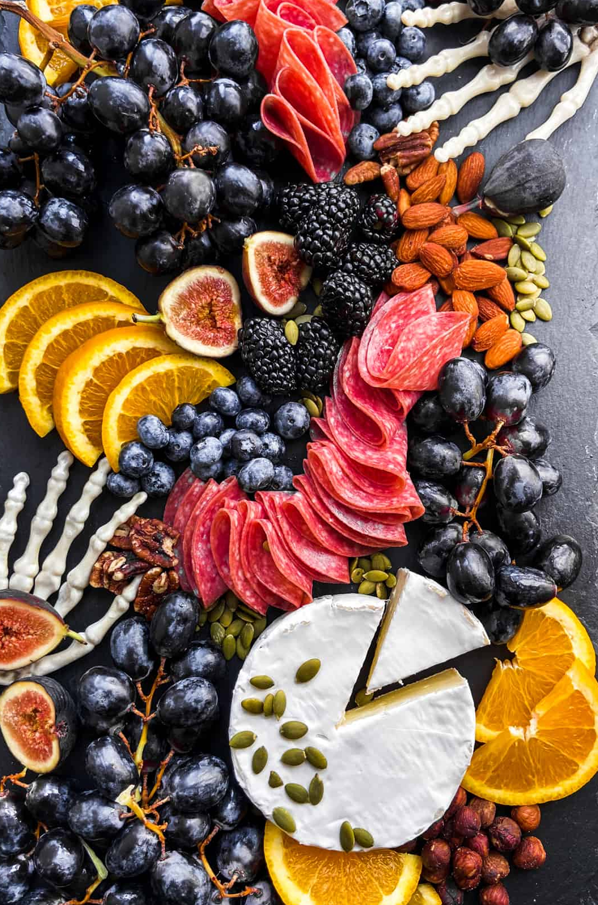 This Healthy Table's Halloween board is filled with almonds, figs, grapes, and meat and cheese.