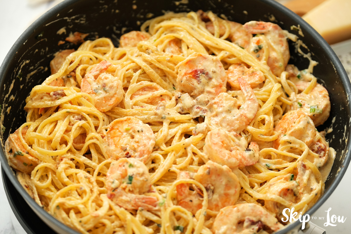 Linguine and Cajun shrimp in a large skillet, by Skip to my Lou.