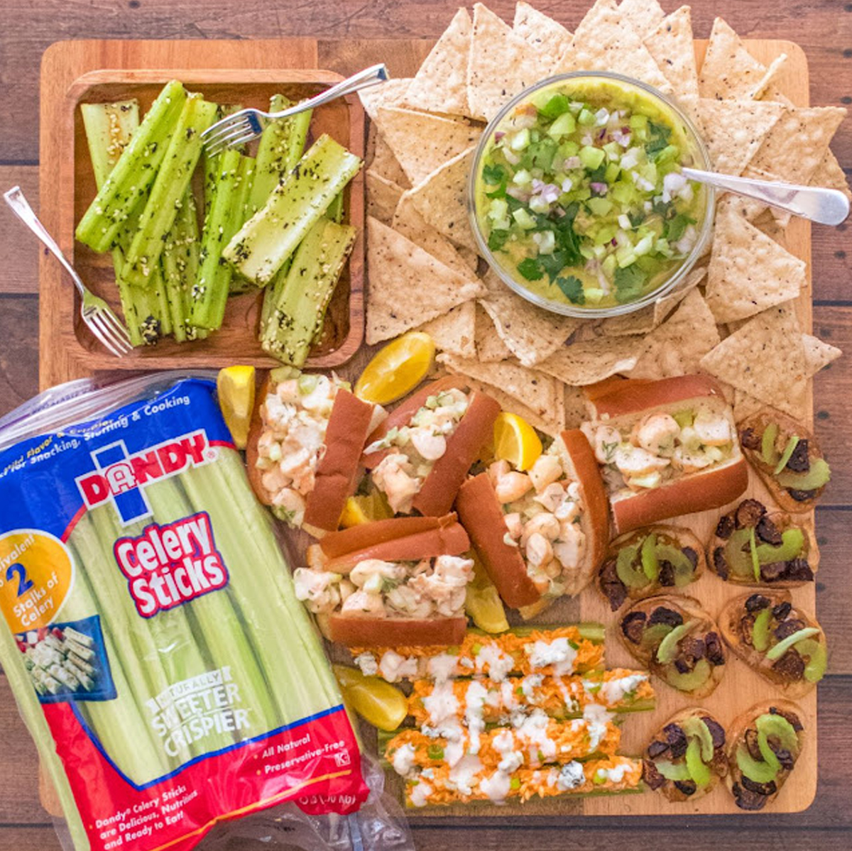 Chips, celery, dips, and buffalo chicken celery sticks are filling The Lunchbox Dad's charcuterie board.