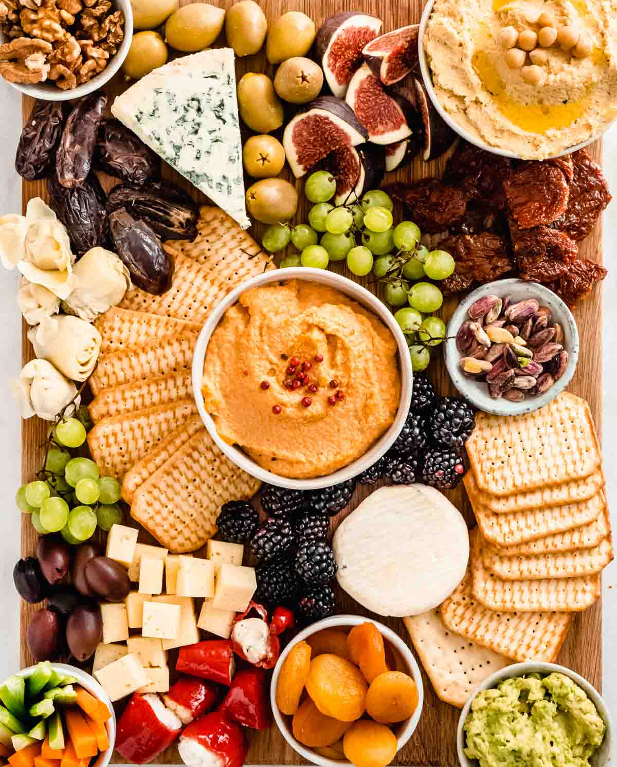 Vegan cheese, celery, olives, nuts, and crackers are displayed on Whole Soulfood Kitchen's Vegetarian board.