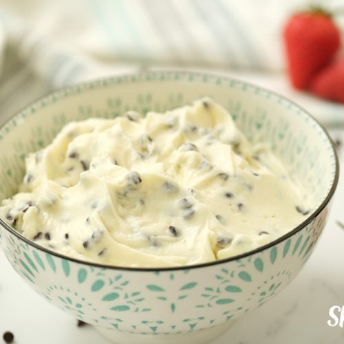 Blue and white serving bowl full of Chocolate Chip Dip, by Skip to my Lou.