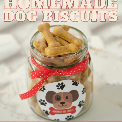 Homemade dog biscuits packaged in a clear glass jar decorated with a red and white polka dot label and a printable label, by Skip to my Lou.
