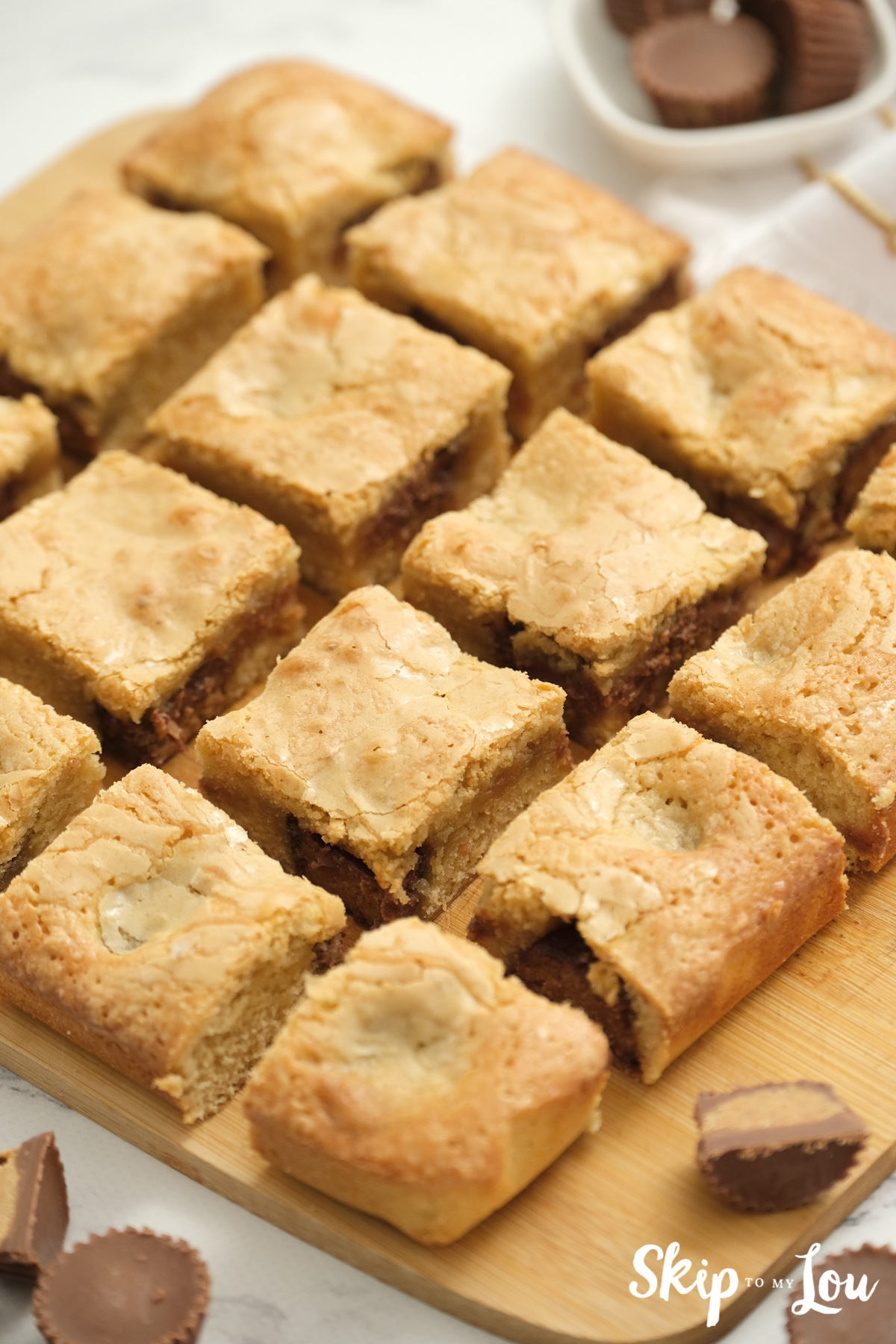 Peanut butter blondies sliced and ready to serve, by Skip to my Lou.