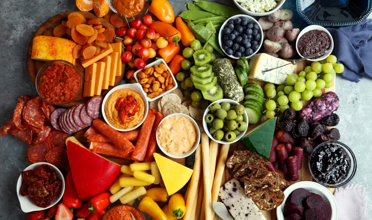 An overflowing rainbow charcuterie board from food.com