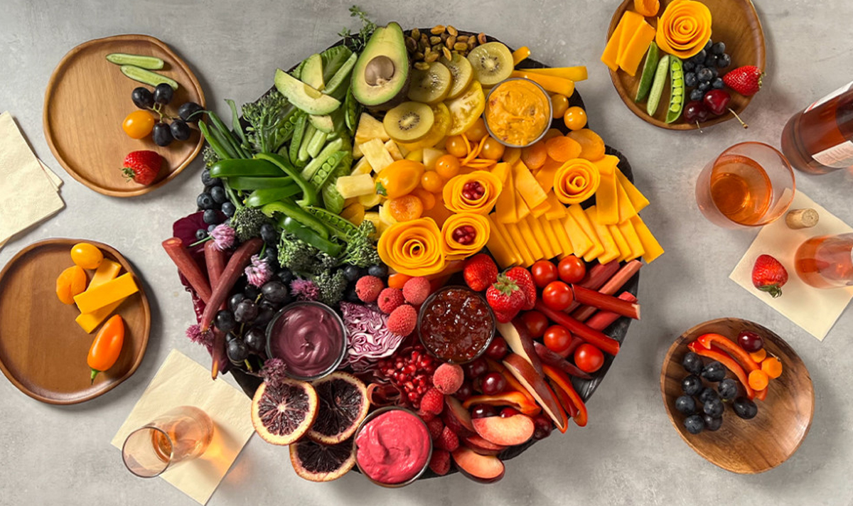 sargento's cheese, veggies, dips, and more on this rainbow charcuterie board.