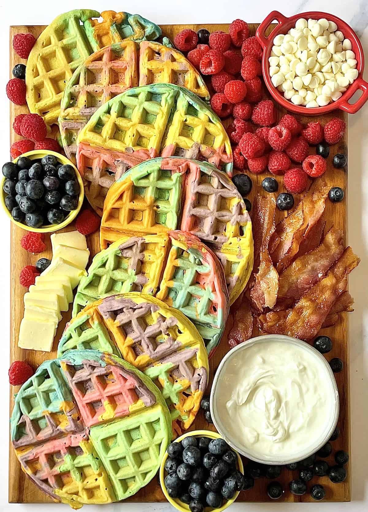 tasty oven has created rainbow waffles with white chocolate chips, fruits, and more.