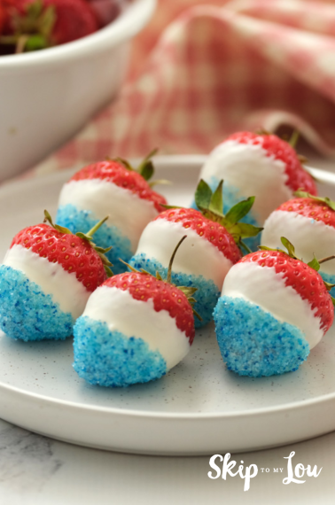 Image shows a plate with red, white and blue strawberries for a 4th of July dessert.