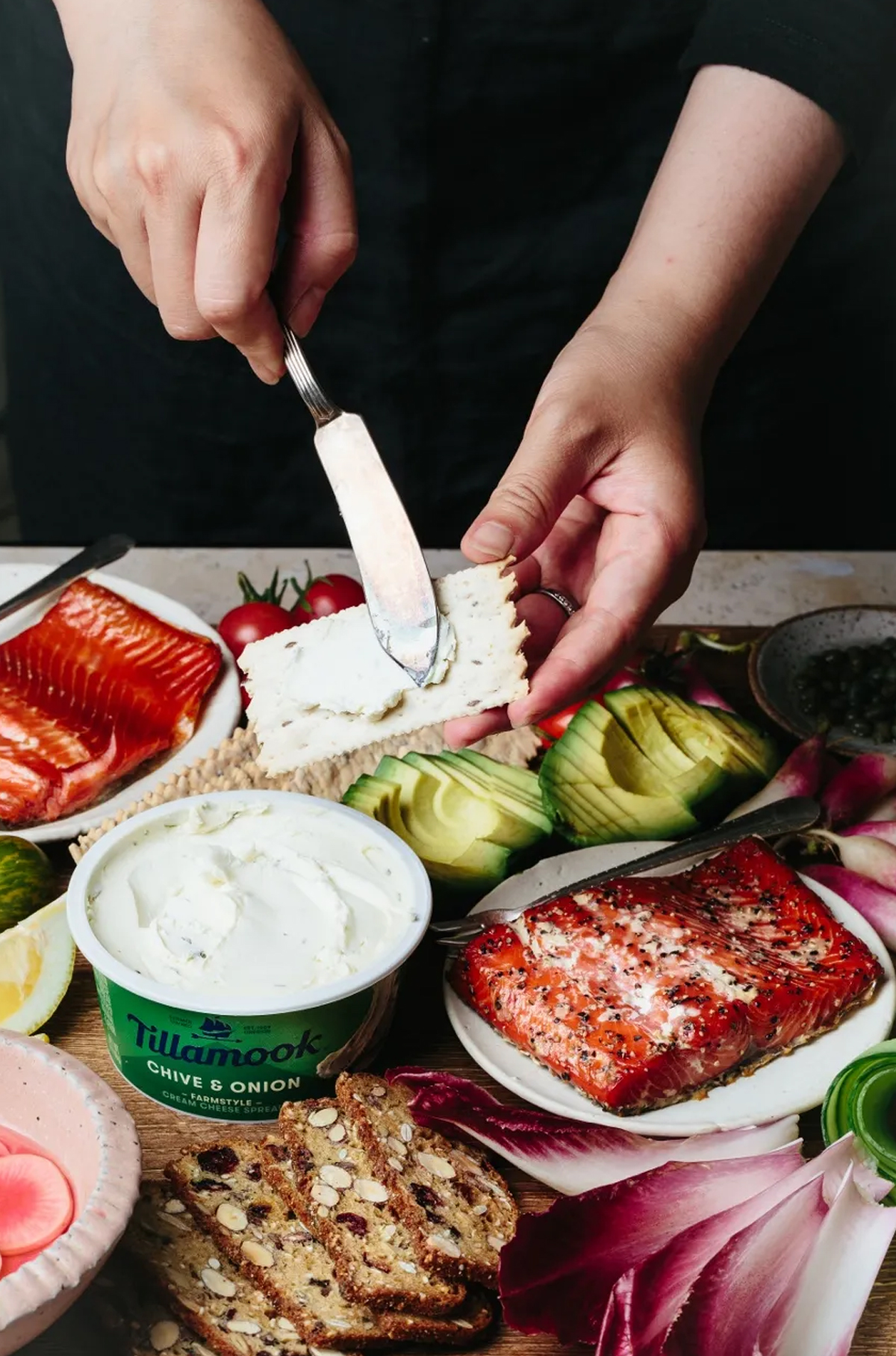 Beyond Sweet and Savory's board is filled with onion dip, hard boiled eggs, salmon, and avocado.
