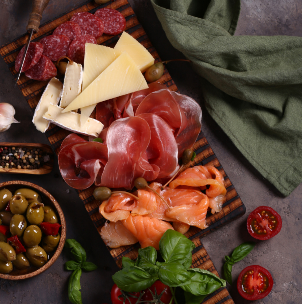 BluGlacier's charcuterie board is filled with salmon, meats, olives, and cheese.