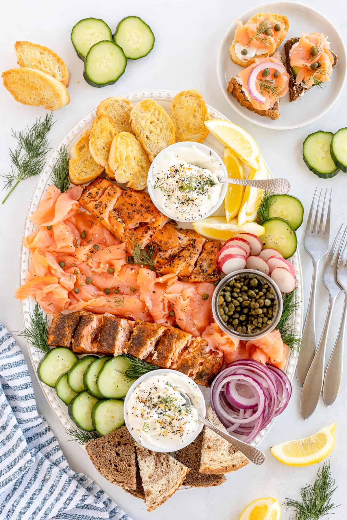Valerie's KItchen salmon platter is filled with sour cream, bagel chips, and salmon.