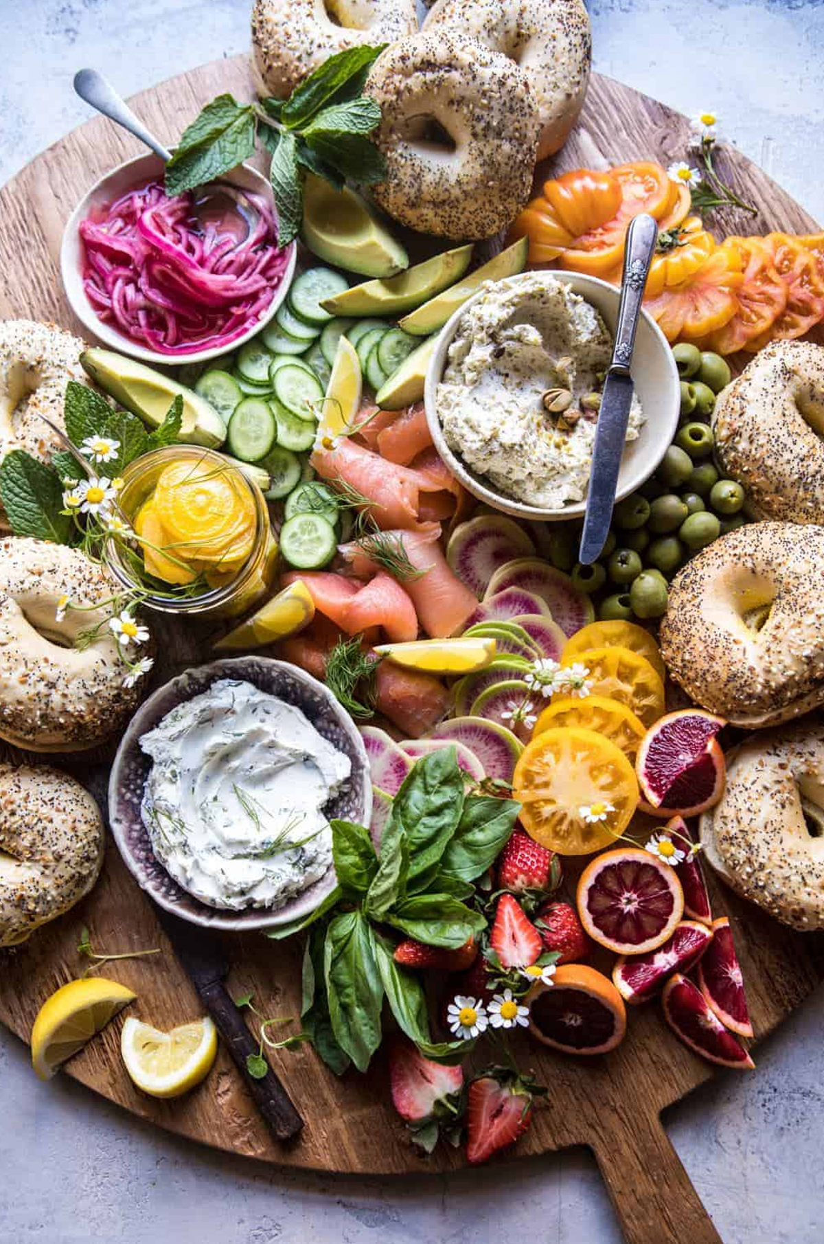 Bagels, smoked salmon, cream cheese, and red onions fill Half Baked Harvest's charcuterie board.