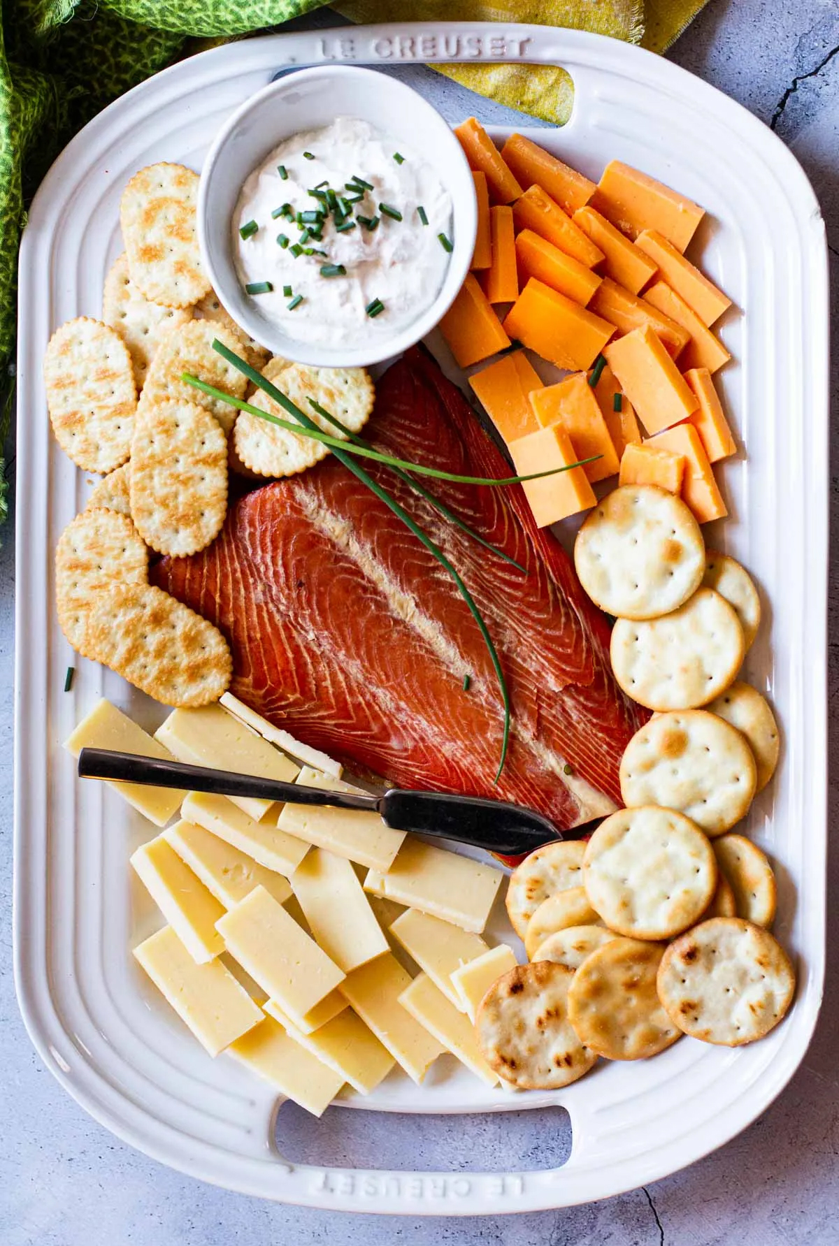 Cheese, smoked salmon, and crackers are included on Highlands Ranch Foodie's charcuterie board.