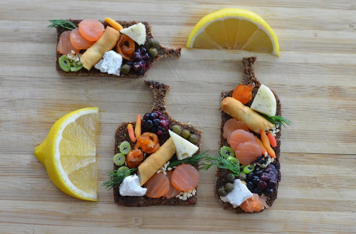 Smoked salmon, cheese, and fruit fill Instructables smoked salmon charcuterie board.