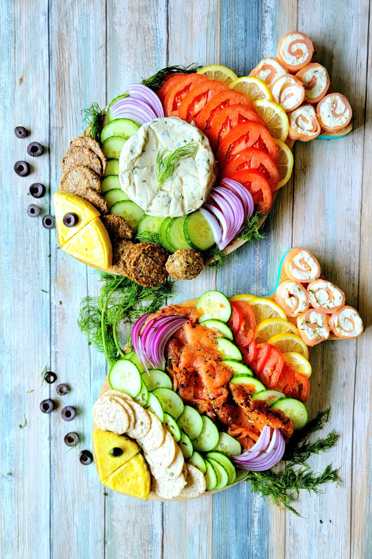 Kosher Everyday's Smoked Salmon Charcuterie board is filled with fresh veggies, cream cheese, crackers, onions and cucumbers.
