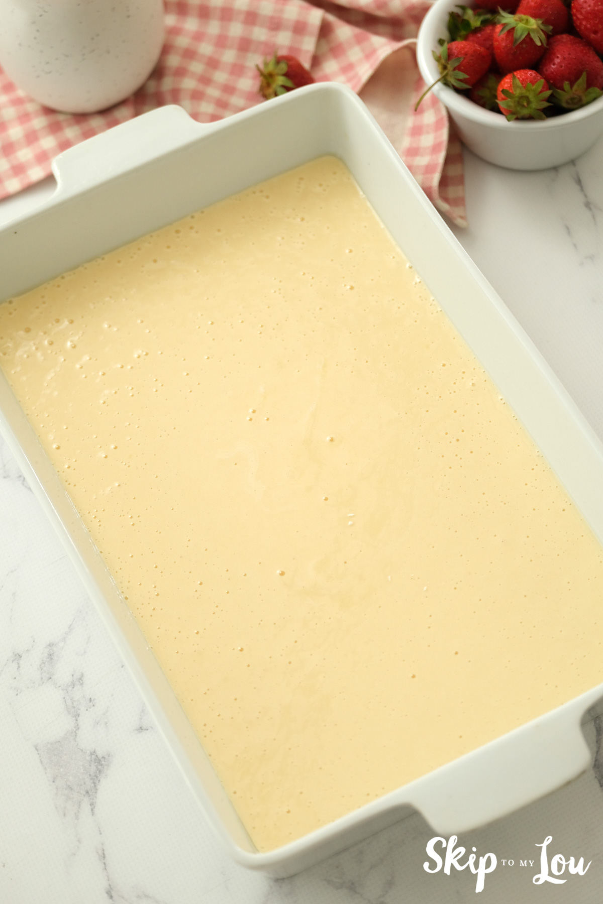 Cake batter in a 9"x13" inch baking pan, by Skip to my Lou.