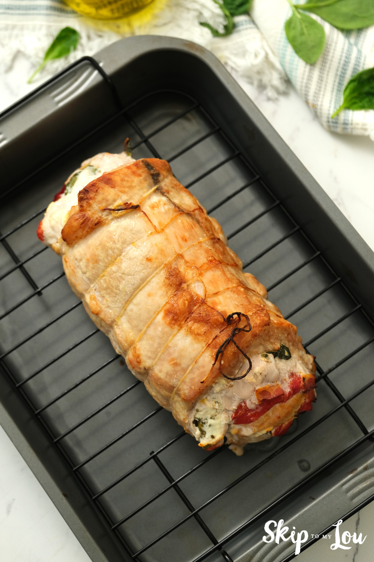 Roasted stuffed pork tenderloin, by Skip to my Lou.
