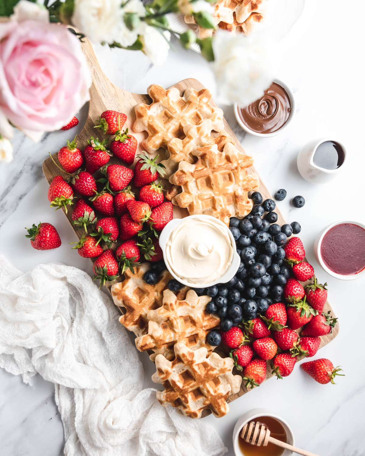 baked by Chichi created a waffle board with full strawberries, nutella, blueberries and plenty of sweet toppings.