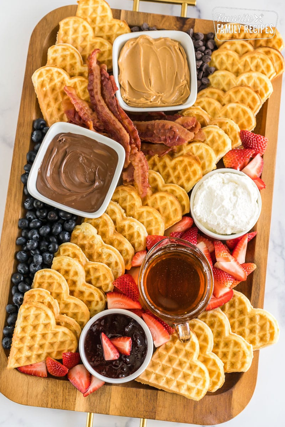 favorite family recipes includes heart shaped waffles and plenty of delicious toppings.