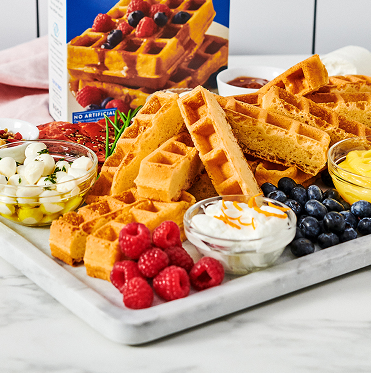 Krusteaz has some waffle sticks next to mozzarella, lemon curd, and more.