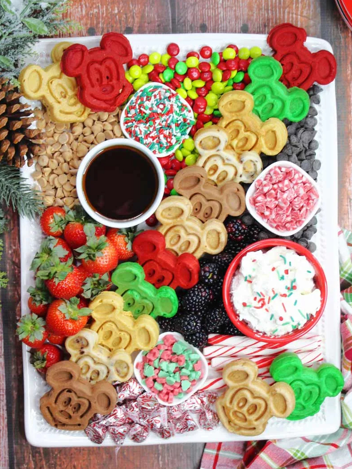 mickey themed waffles that are green, red, brown, and more surrounded by some sprinkles. candies, and more from the purple pumpkin blog