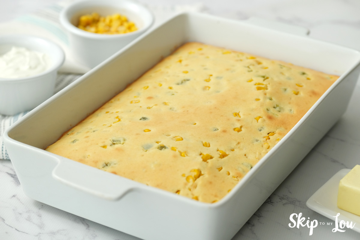 White baking dish with baked cornbread, by Skip to my Lou.